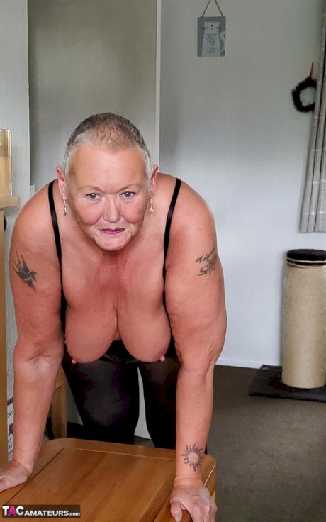 Fat granny Valgasmic Exposed sports short hair while exposing her tits & pussy