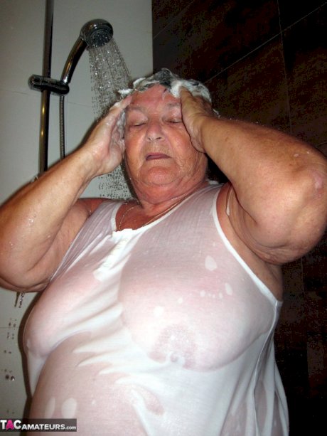 Obese amateur Grandma Libby blow drys her hair after taking a shower