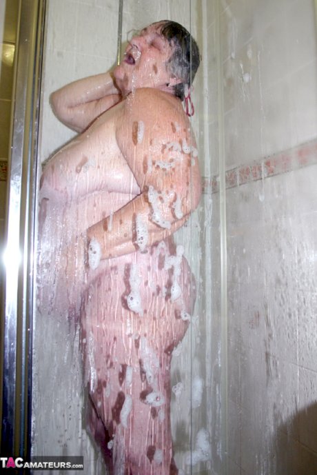 Obese granny Grandma Libby fondles her naked body while taking a shower