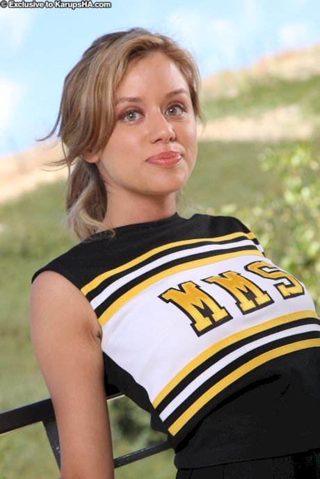 Sexy cheerleader Summer strips on the balcony and flaunts her fantastic body
