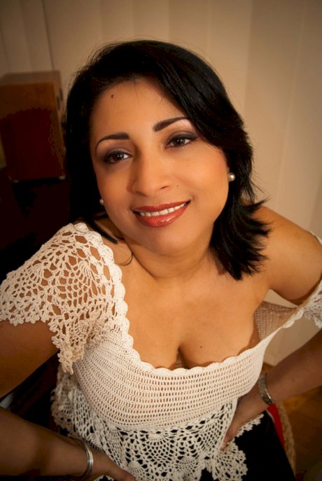 Plump Indian chick shows her big naturals in and out of clothes