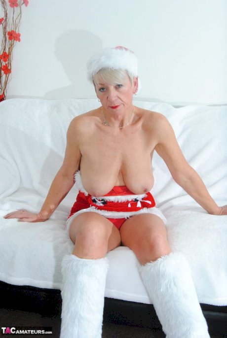 Brazen horny granny Shazzy B hangs her big saggy boobs out by the Xmas tree