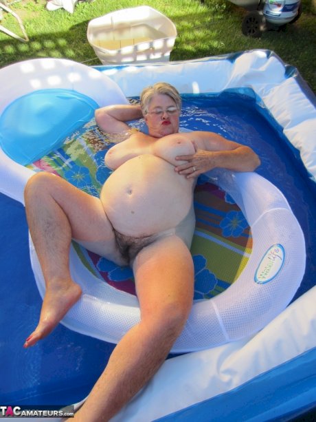 Fatty mature granny Girdle Goddess peels to enjoy wading pool skinny dip