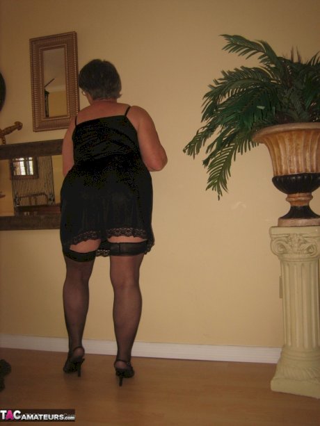 Old oma Girdle Goddess unleashes her huge tits before toying her pussy