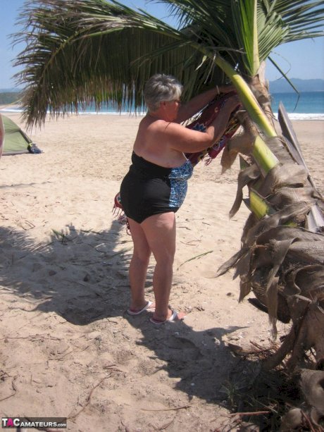 Fat granny Girdle Goddess takes off swimwear to pose nude at the ebach