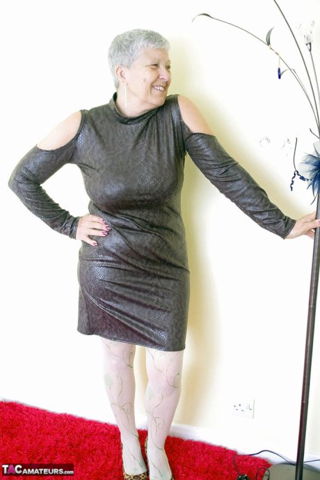 Old amateur Savana removes a leather dress before rolling down her pantyhose