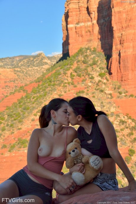 Amateur babe Saraya strips and poses naked with her busty friend in public