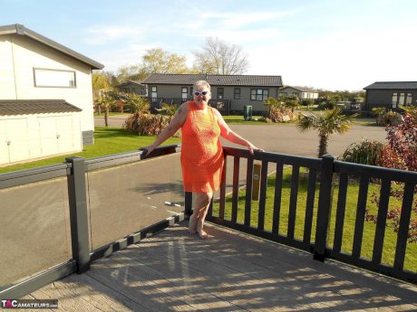 Fat nan bares her boobs while in a patio hot tub before getting naked on a bed