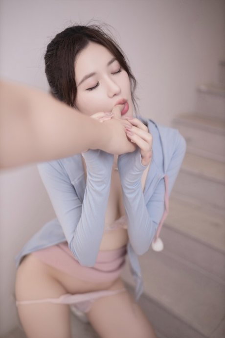 Petite Asian babe removes her panties while showing off her sexy legs