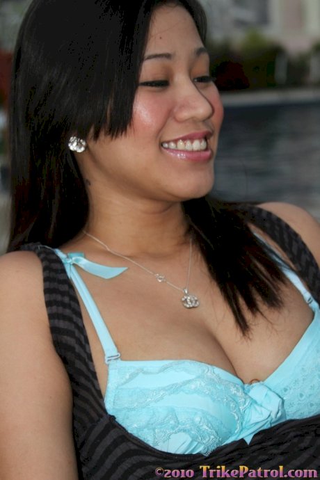 Black haired Asian amateur Betyna strips and masturbates in a solo