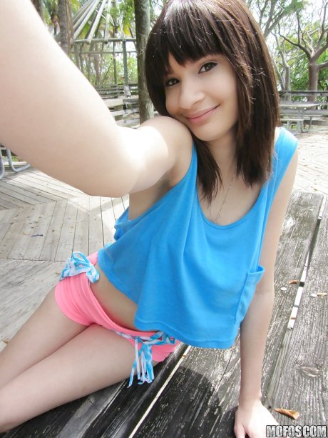 Latina babe Jessi Grey dose self shots of her tiny tits outdoor