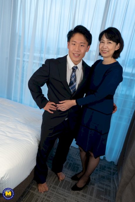 Mature Japanese woman has sex with her man friend while wearing OTK hosiery