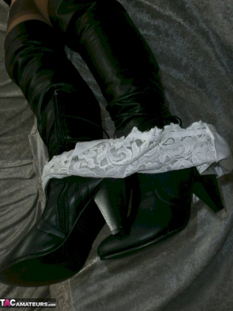 Mature lady next door in black boots Caro uses a huge dildo on her hairy twat