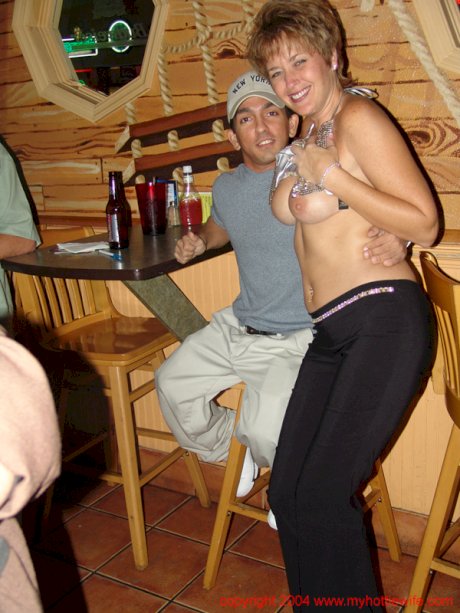 Naughty mature wife Tracy Lick shows off her big tits at a swingers party
