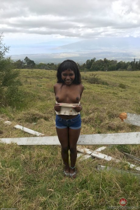 Petite ebony Noemie Bilas exposing her tits, pussy and feet in a solo