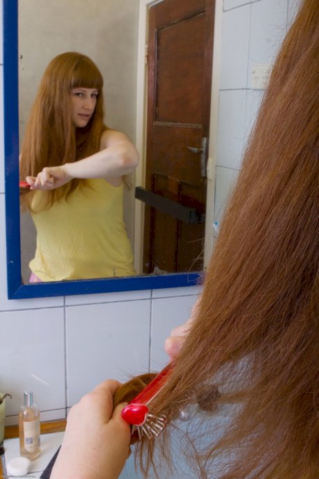 Ginger Chloe B unveils her big tits & ass before rubbing her pierced muff