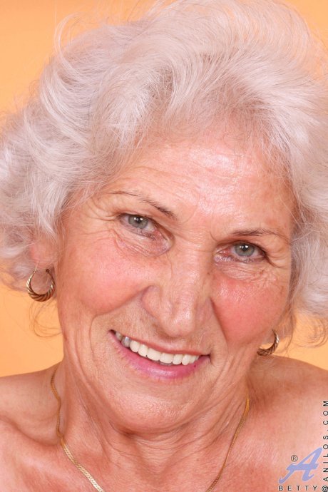 Grey haired granny Betty exposes her saggy juggs and fingers her clam