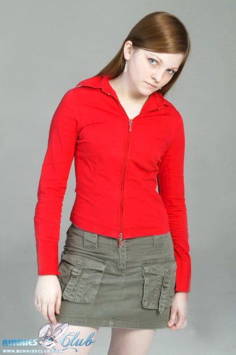 Pale redhead Lilly slowly strips to a black G-string and red leather boots