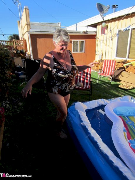 Fatty mature granny Girdle Goddess peels to enjoy wading pool skinny dip
