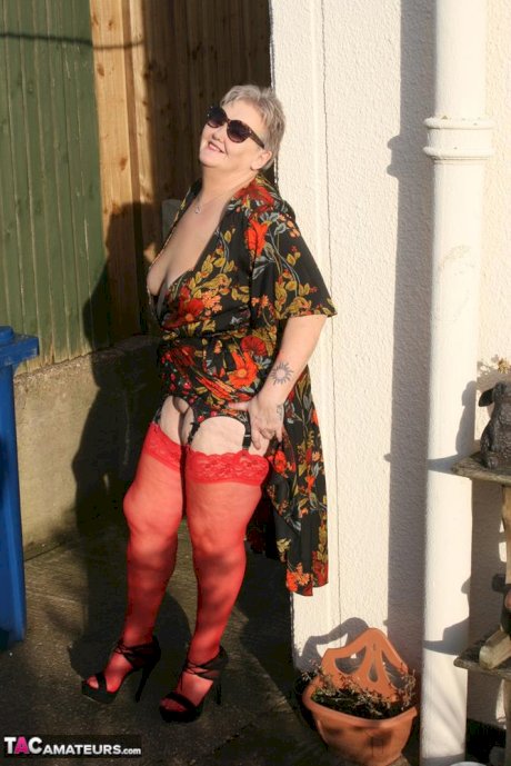Old woman Valgasmic Exposed exposes saggy tits and big ass in yard