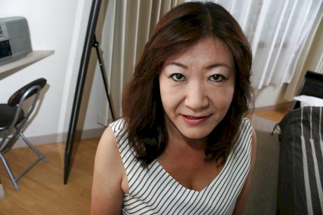 Asian granny Michiko Okawa undressing and exposing her hairy twat in close up