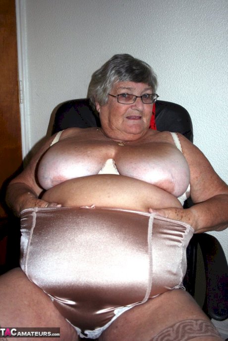 Obese nan Grandma Libby parts her shaved pussy after removing satin underwear