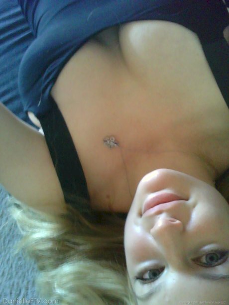 Blonde amateur Danielle takes sexy selfies around her home in a SFW manner