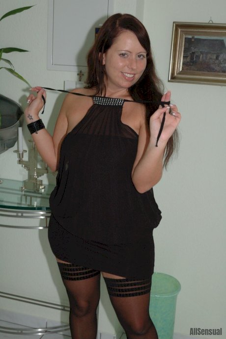 Thick brunette Benita uncovers her natural tits before upskirt action