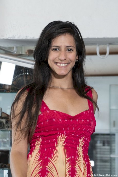 Teen amateur Pamela exposes her furry armpits and beaver in a motorcycle shop