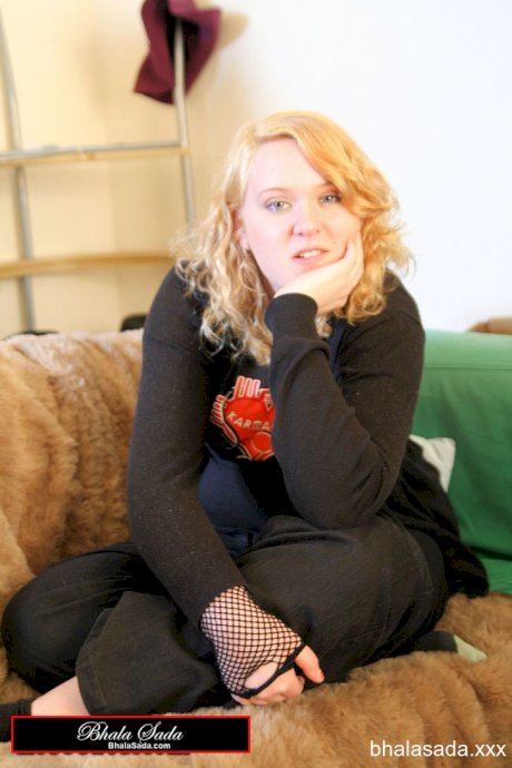 Redheaded fatty strips her sweatshirt and shows her cleavage in a black bra
