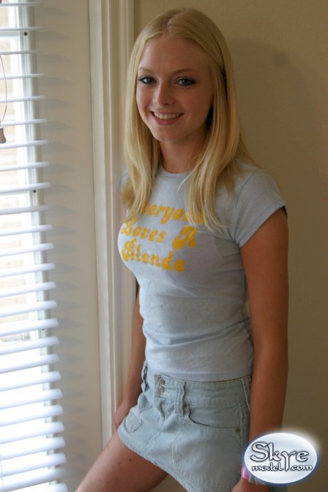 Blonde amateur Skye Model models by herself in a short skirt