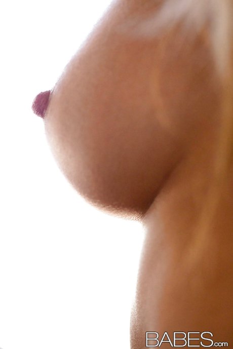 Cuddly babe Emma Mae showcasing her perfect tits and shaved slit