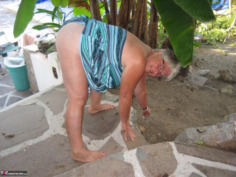 Old woman Girdle Goddess smokes before exposing her fat body on her patio