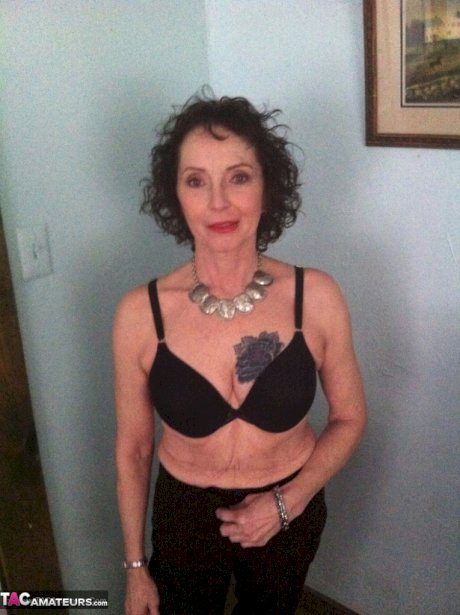 Curly haired mature woman likes sending her younger partner provocative photos