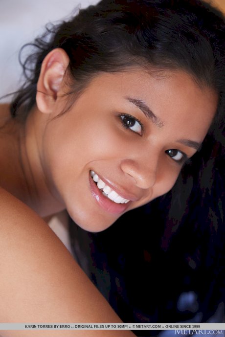 Latina teen Karin Torres highlights her nice cunt after getting naked on a bed
