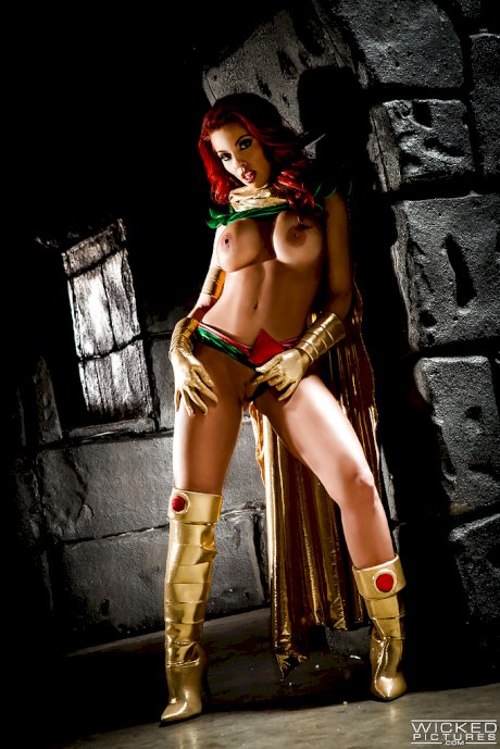 Busty redhead Britney Amber modeling topless in cosplay outfit