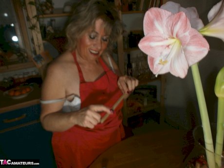 Horny oma Caro pleasures her pussy with a wooden spoon and a cucumber