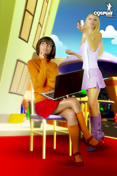 Lesbian girls fondle each other while dressed in cosplay clothing