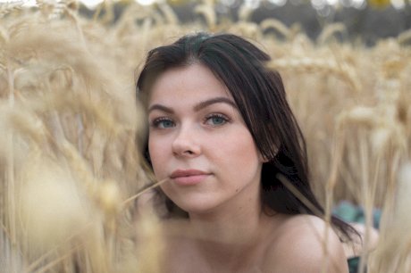 Breathtaking amateur babe Lyalya massages her big tits in a wheat field