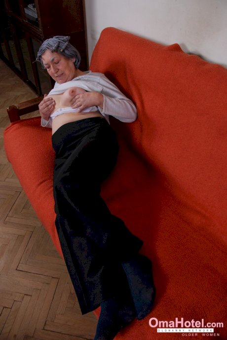 Grey haired granny Margarethe reveals her amazing breasts and plays with a toy